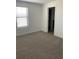 Bedroom with light gray carpet and natural light from the window at 3432 Tranquil Trl, Kissimmee, FL 34747