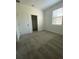 Bright bedroom with closet, carpeted floors, and large window offering natural light at 3432 Tranquil Trl, Kissimmee, FL 34747