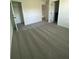 Spacious bedroom with neutral carpet, white walls and multiple doors at 3432 Tranquil Trl, Kissimmee, FL 34747