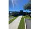 Charming community clubhouse with well-kept landscaping, pathway and front entrance at 3432 Tranquil Trl, Kissimmee, FL 34747
