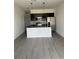 Modern kitchen with stainless steel appliances, dark cabinets, and subway tile backsplash at 3432 Tranquil Trl, Kissimmee, FL 34747