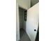 View into the pantry with wire shelving and dark gray flooring at 3432 Tranquil Trl, Kissimmee, FL 34747