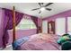 Bedroom with purple walls and a four-poster bed at 3631 Surrey Dr, Orlando, FL 32812