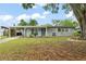 Charming single-story home with a carport, tidy landscaping, and inviting curb appeal at 3631 Surrey Dr, Orlando, FL 32812