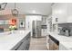 Updated kitchen featuring white cabinets, stainless appliances, and a large island at 3631 Surrey Dr, Orlando, FL 32812