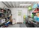 A functional laundry room offers storage shelves and modern washer and dryer units at 3631 Surrey Dr, Orlando, FL 32812