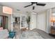Cozy room featuring an area rug, ceiling fan, and access to other rooms in the house at 3631 Surrey Dr, Orlando, FL 32812