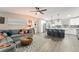 Open concept living area connected to the kitchen offers comfortable seating and natural light at 3631 Surrey Dr, Orlando, FL 32812