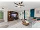 Comfortable living room features a large built-in entertainment center and stylish decor at 3631 Surrey Dr, Orlando, FL 32812