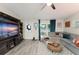 Bright living room features a large window, comfortable seating, and stylish decor at 3631 Surrey Dr, Orlando, FL 32812