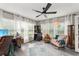 Office space featuring a ceiling fan, large windows, and an area rug at 3631 Surrey Dr, Orlando, FL 32812