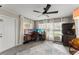 Bright room with large windows and ceiling fan is set up as a home office at 3631 Surrey Dr, Orlando, FL 32812