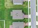 Overhead view of home with a well-manicured lawn, landscaping, and a paved driveway at 3970 Clipstone Pl, Sanford, FL 32773