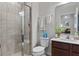 Modern bathroom with a glass-enclosed shower, a vanity with ample storage space, and contemporary fixtures at 3970 Clipstone Pl, Sanford, FL 32773