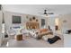 Bedroom with a large bed, two windows with blinds, and adjacent bathroom area at 3970 Clipstone Pl, Sanford, FL 32773