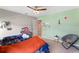 Brightly colored bedroom with colorful accessories and a ceiling fan at 3970 Clipstone Pl, Sanford, FL 32773