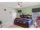 Bedroom with a book-lined headboard and natural light from a window at 3970 Clipstone Pl, Sanford, FL 32773