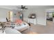 Bedroom with decor elements and a view into the bathroom, natural light streaming through windows at 3970 Clipstone Pl, Sanford, FL 32773