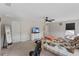 Bright bedroom with a fan, white dresser, and a view of the doorway leading to another room at 3970 Clipstone Pl, Sanford, FL 32773