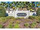 Stone entrance to Kensington Reserve with well-maintained landscaping at 3970 Clipstone Pl, Sanford, FL 32773