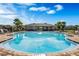Enjoy this community pool with ample seating, palm trees and a resident clubhouse at 3970 Clipstone Pl, Sanford, FL 32773
