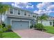 Lovely two-story home featuring a two-car garage, mature trees and beautiful landscaping at 3970 Clipstone Pl, Sanford, FL 32773