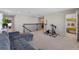 View of the upstairs loft featuring a gray sofa, exercise equipment, and iron railing at 3970 Clipstone Pl, Sanford, FL 32773