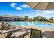 Inviting community pool area with lounge chairs, umbrellas, and landscaped surroundings at 3970 Clipstone Pl, Sanford, FL 32773