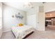 Comfortable bedroom with carpet flooring and a window allowing natural light to fill the room at 4231 Swan St, Haines City, FL 33844