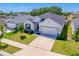 Charming one-story home with a two-car garage, manicured lawn, and welcoming curb appeal at 4231 Swan St, Haines City, FL 33844