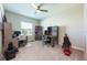 Well-lit office space with dual desks, carpet, bookshelves, and ample workspace at 4231 Swan St, Haines City, FL 33844