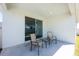 Outdoor patio with chairs and table, perfect for relaxing or entertaining guests at 4231 Swan St, Haines City, FL 33844