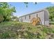 Lush backyard features a new wooden deck, green grass, and a well-maintained home exterior at 4425 Mobilaire Dr, Orlando, FL 32822
