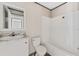 Functional bathroom features a tub, toilet and a vanity with granite countertop at 4425 Mobilaire Dr, Orlando, FL 32822
