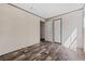 Spacious bedroom with wood-look floors, closet, and neutral walls is move-in ready at 4425 Mobilaire Dr, Orlando, FL 32822