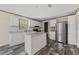 Clean kitchen with modern appliances and spacious island, perfect for Gathering meals at 4425 Mobilaire Dr, Orlando, FL 32822