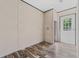 A tidy laundry room with tile flooring, a window, and washer and dryer hookups at 4425 Mobilaire Dr, Orlando, FL 32822