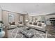 Bright living room with modern decor and plenty of natural light, perfect for entertaining at 4425 Mobilaire Dr, Orlando, FL 32822