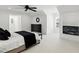 Bedroom with a large window with natural light, sleek ceiling fan, and neutral walls at 4517 Old Carriage Trail, Oviedo, FL 32765