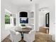 Bright breakfast nook with a built-in aquarium and bay window overlooking lush greenery at 4517 Old Carriage Trail, Oviedo, FL 32765