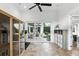 Exercise room with stone floors and access to the outdoor patio at 4517 Old Carriage Trail, Oviedo, FL 32765