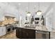 Gourmet kitchen featuring stone countertops and stainless steel appliances at 4517 Old Carriage Trail, Oviedo, FL 32765