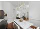 Open-concept living area with hardwood floors, pool views, and seamless transition to the dining room at 4517 Old Carriage Trail, Oviedo, FL 32765
