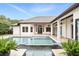 An inviting pool and patio area provides a tranquil oasis for relaxation and outdoor enjoyment at 4517 Old Carriage Trail, Oviedo, FL 32765