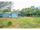 Backyard with an enclosed porch and ample lawn space at 510 Brighton Way, Casselberry, FL 32707
