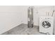Basement area with hot water heater and washing machine at 510 Brighton Way, Casselberry, FL 32707