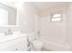 Bright bathroom with subway tiles, toilet, tub and sink at 510 Brighton Way, Casselberry, FL 32707