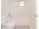 The bathroom has a tiled shower over tub and tile floors at 510 Brighton Way, Casselberry, FL 32707