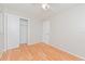 Bedroom with a ceiling fan, wood-look flooring, and ample closet space at 510 Brighton Way, Casselberry, FL 32707