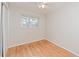 This spacious bedroom has wood floors, a window and a ceiling fan at 510 Brighton Way, Casselberry, FL 32707